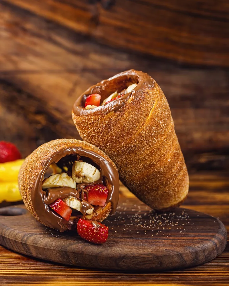 Chimney cakes filled with chocolate, bananas and strawberries at Lumier’s Chimney Cake