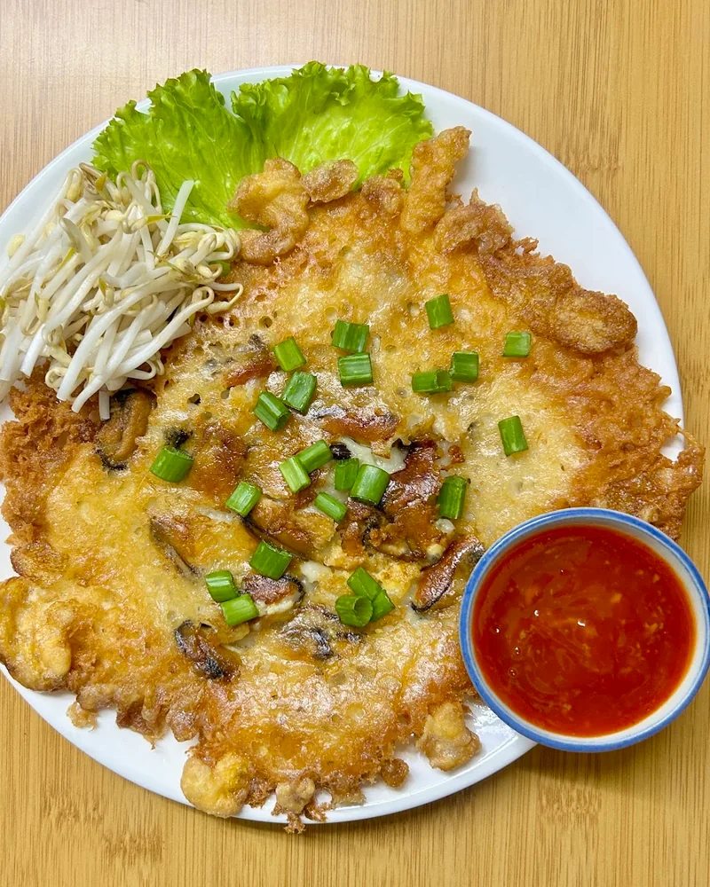 Thai crispy oyster omelette with bean sprouts and chilli sauce at Lumos Thai Restaurant
