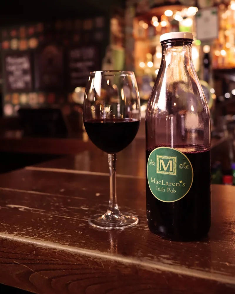 Red wine in a bottle and wine glass at MacLaren's Irish Pub