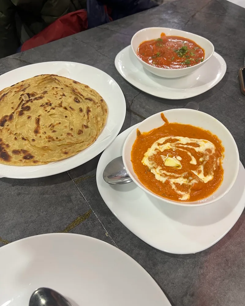 Butter chicken, curry and paratha at Mashallah Indian Restaurant