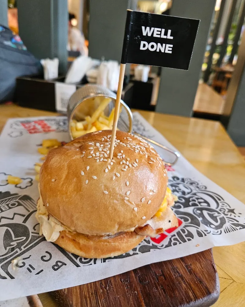 Burger with well done flag and fries at My Chef