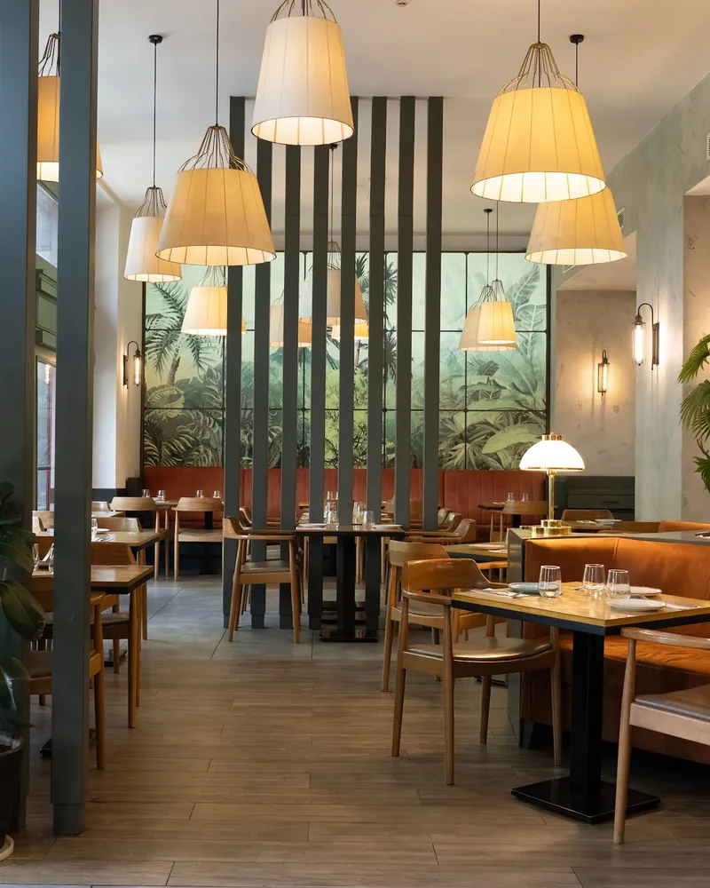 Dining room with wooden slat dividers and pendant lamps at My Chef