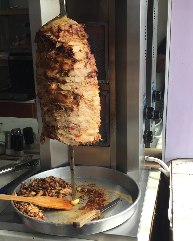 Chicken shawarma spit on a vertical rotisserie at Nawras Aziz Shawarma