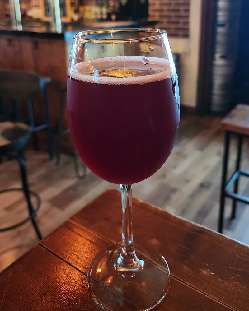 Dark red beer in a stemmed glass at Number 8