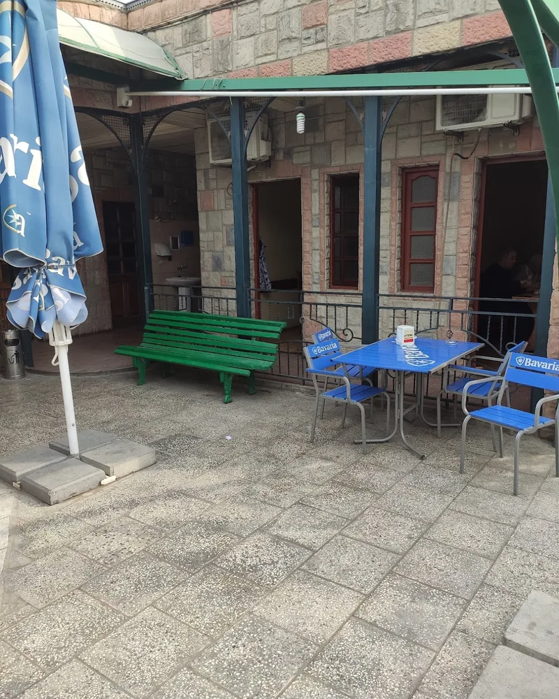 Outdoor courtyard seating area at Ochamchire