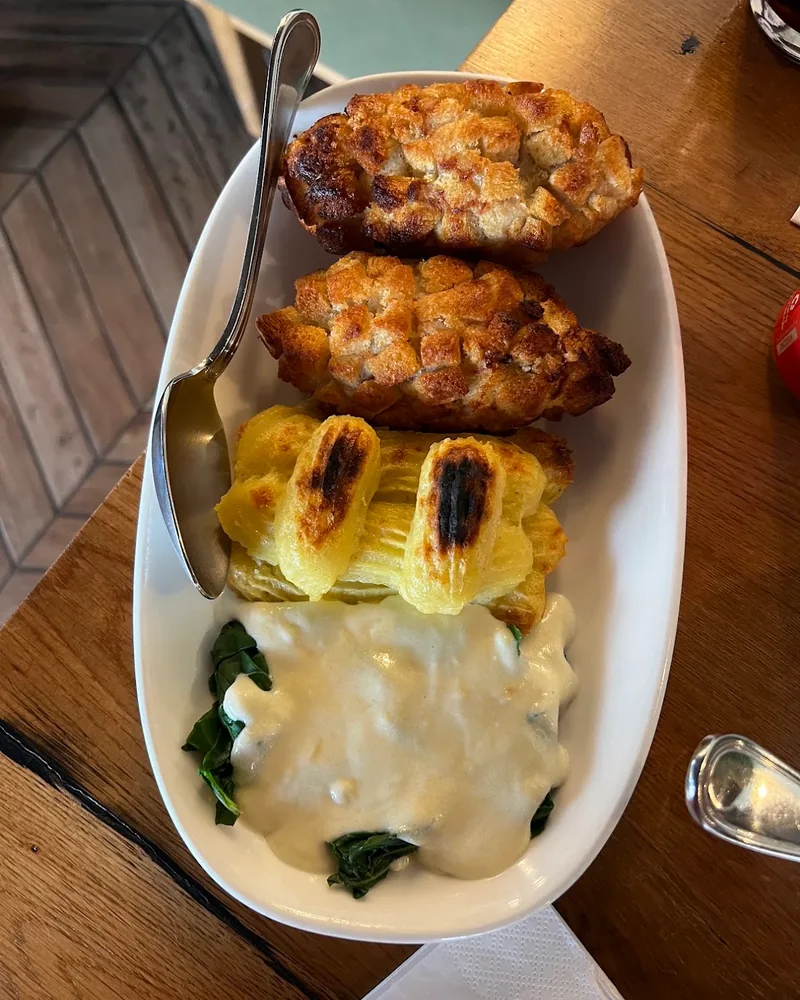 Chicken kiev with mashed potato and spinach at Oro