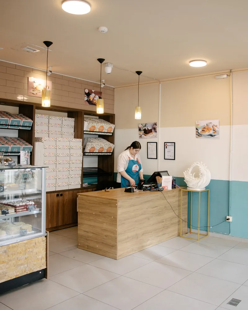 Bakery order counter and pastry display case at Patisserie Bela