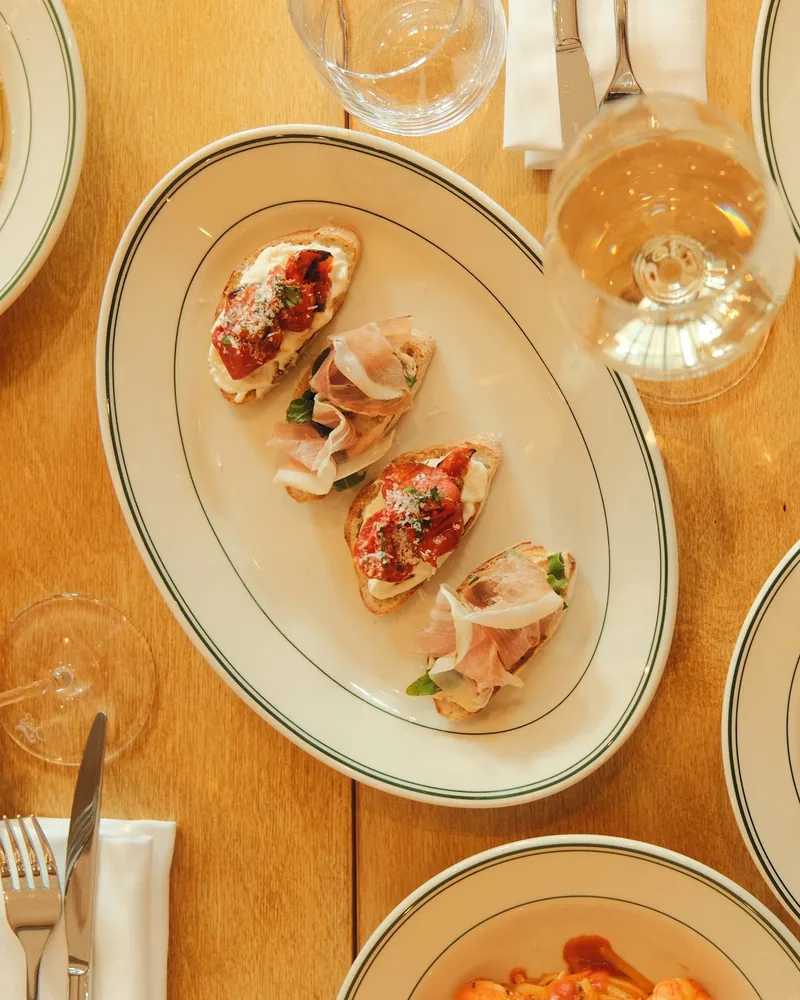 Spread of pasta, bruschetta, and tartare dishes at Philosophico Telegraph