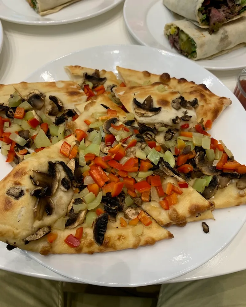 Sliced pide with mushrooms and peppers at Pide Land