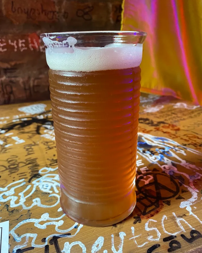 Beer in a textured glass at Ploho Bar