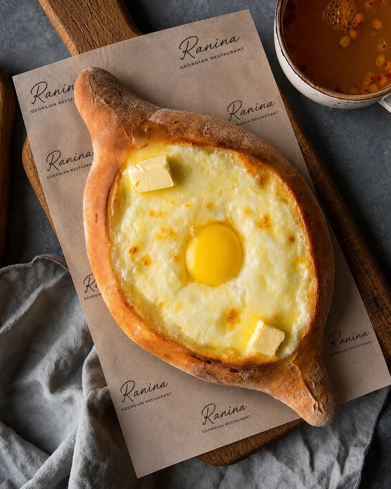 Adjarian khachapuri with egg yolk and butter at Ranina