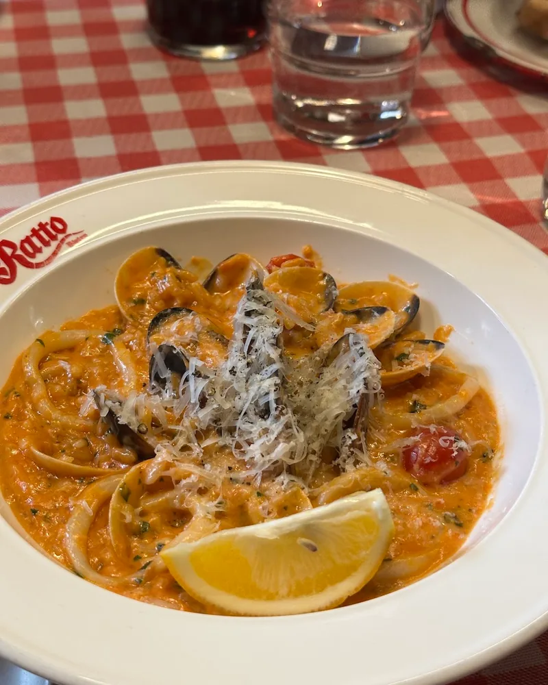 Seafood pasta with clams, calamari and a lemon wedge at Ratto Bistro