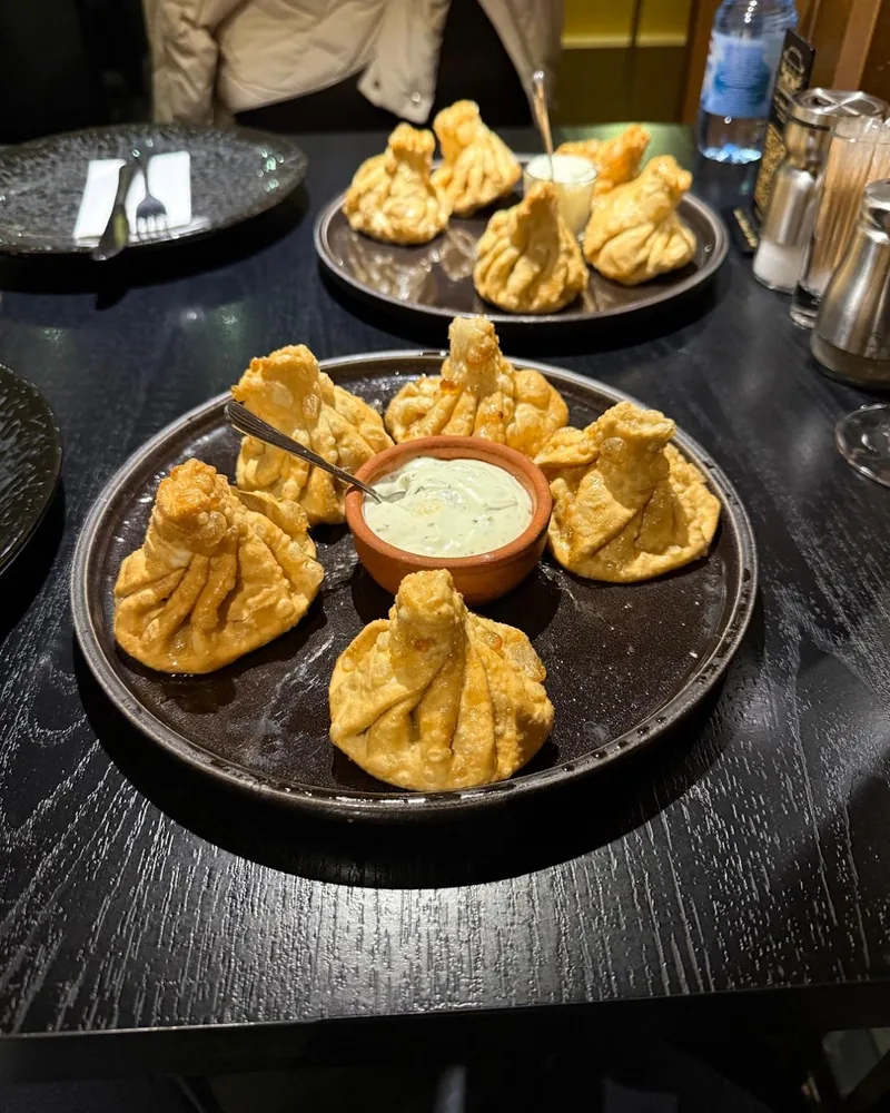 Fried khinkali with dipping sauce at Hide