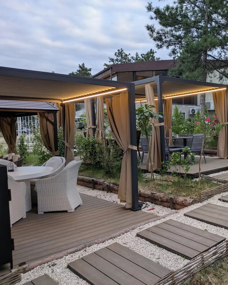 Outdoor cabanas and garden seating at Pasanauri (Tskneti)