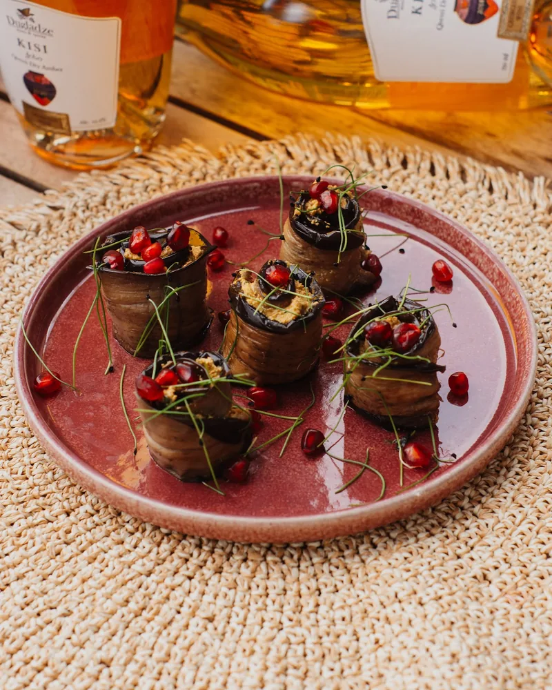 Badrijani nigvzit on a red plate at Usakhelouri
