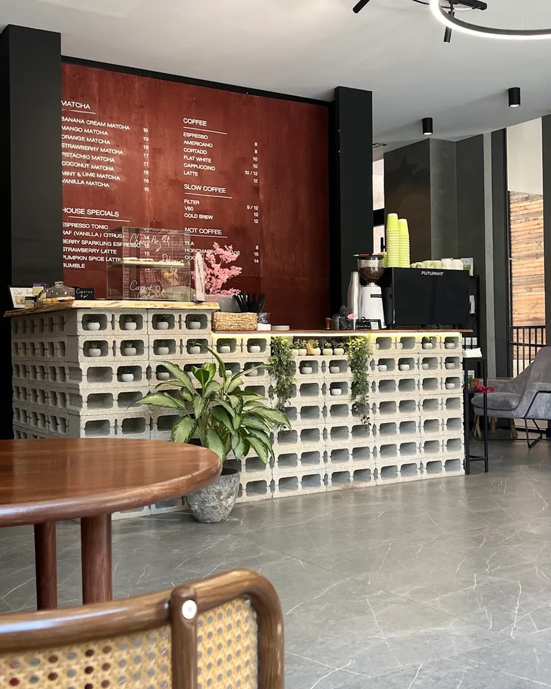 Breeze block bar counter and red menu wall at Rituals Matcha Bar