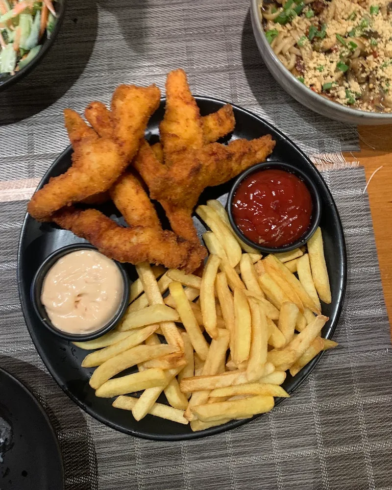 Chicken tenders and french fries with dipping sauces at Saikou Sushi Bar