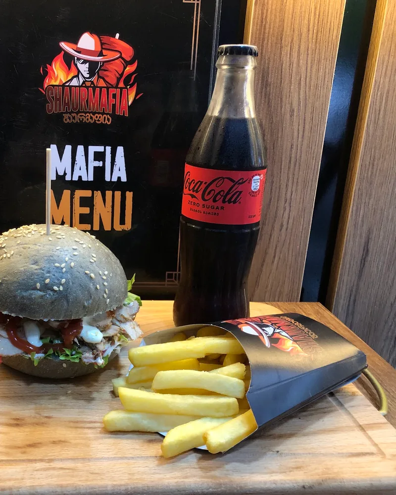 Burger with fries and a bottle of coke at Shaurmafia