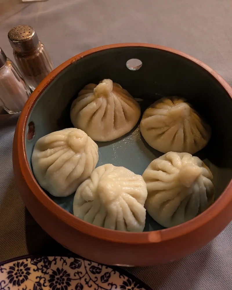 Khinkali in a steamer bowl at Sheen Aura