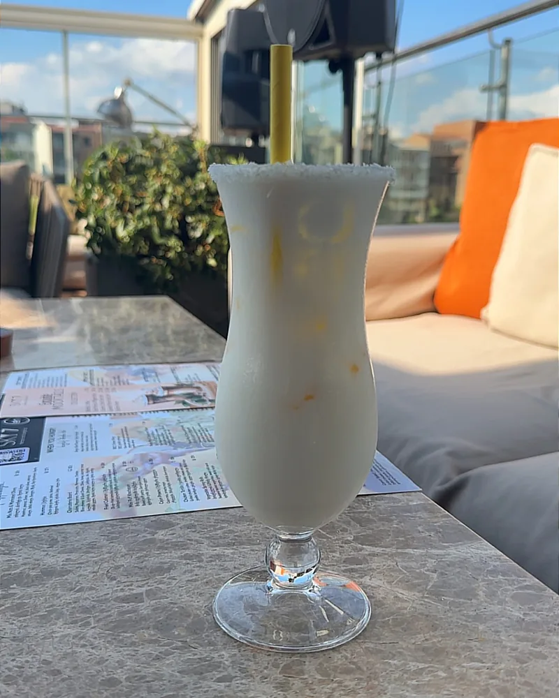 Piña colada in a hurricane glass at Sky7 Terrace & Lounge Bar