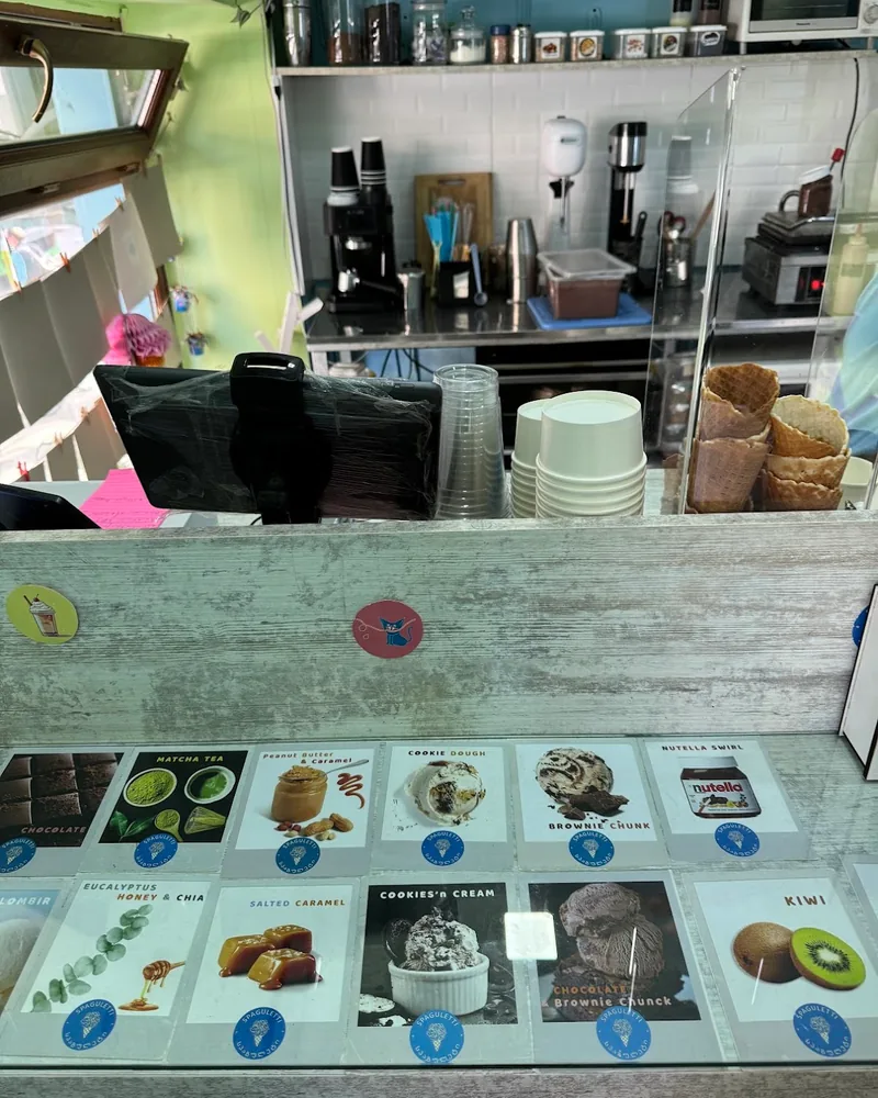 Ice cream counter with flavour cards and equipment at Spaguletti Ice Cream & Waffles