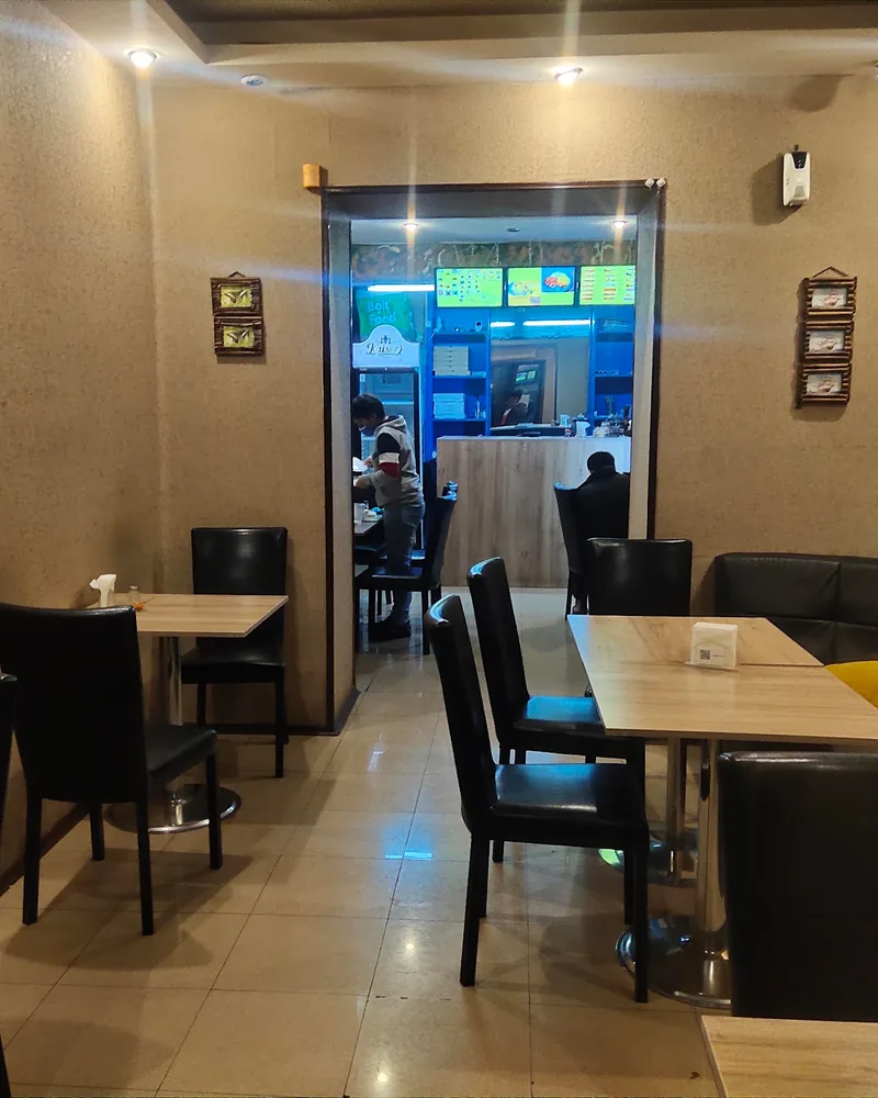 Dining room with tables and leather booth at Spectra