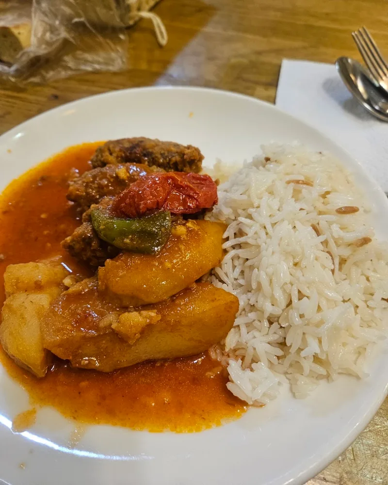 Turkish stew with meatballs and potatoes served with rice at Supra Turkish