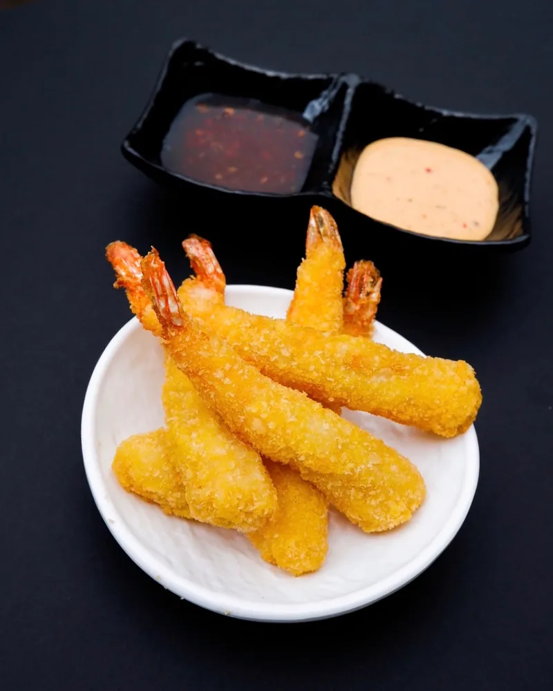 Crispy fried tempura shrimp with dipping sauces at Sushiman