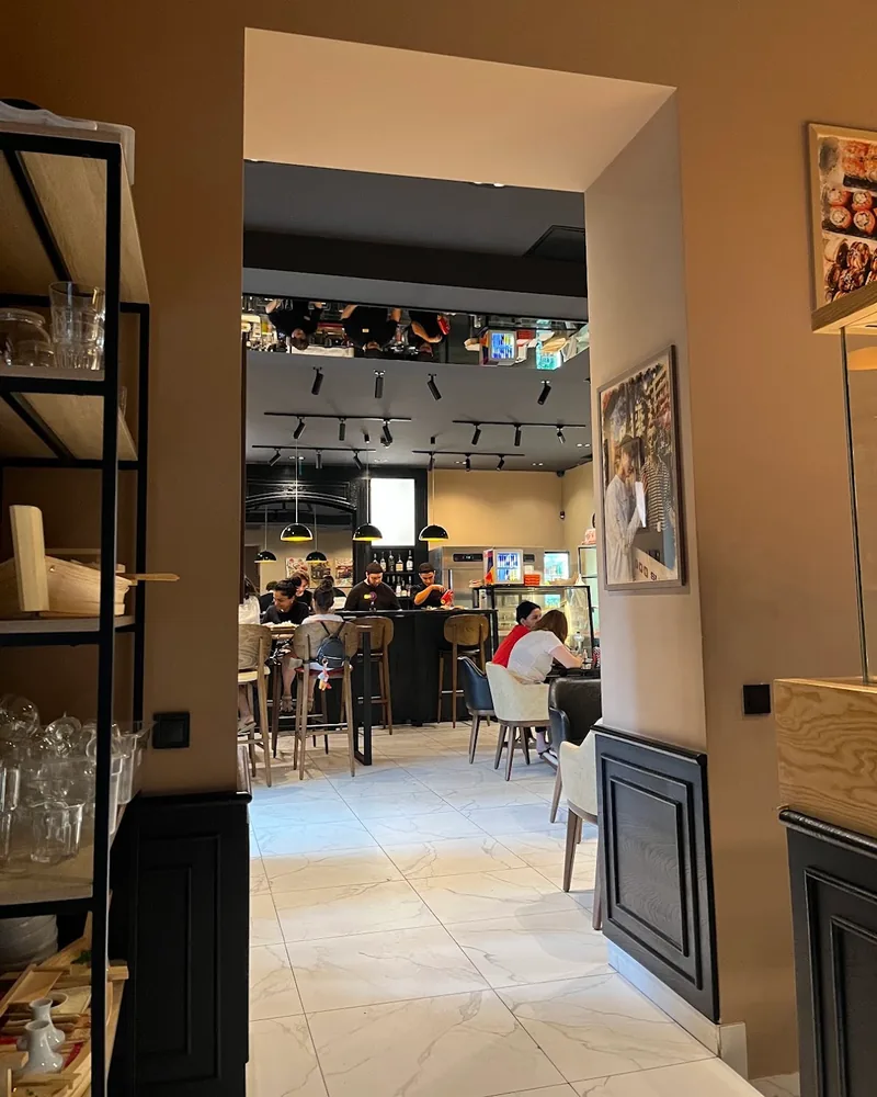 Dining room seen through a doorway at Sushiman
