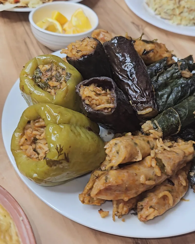 Platter of stuffed vegetables including dolma, peppers and eggplants at Tasty Town