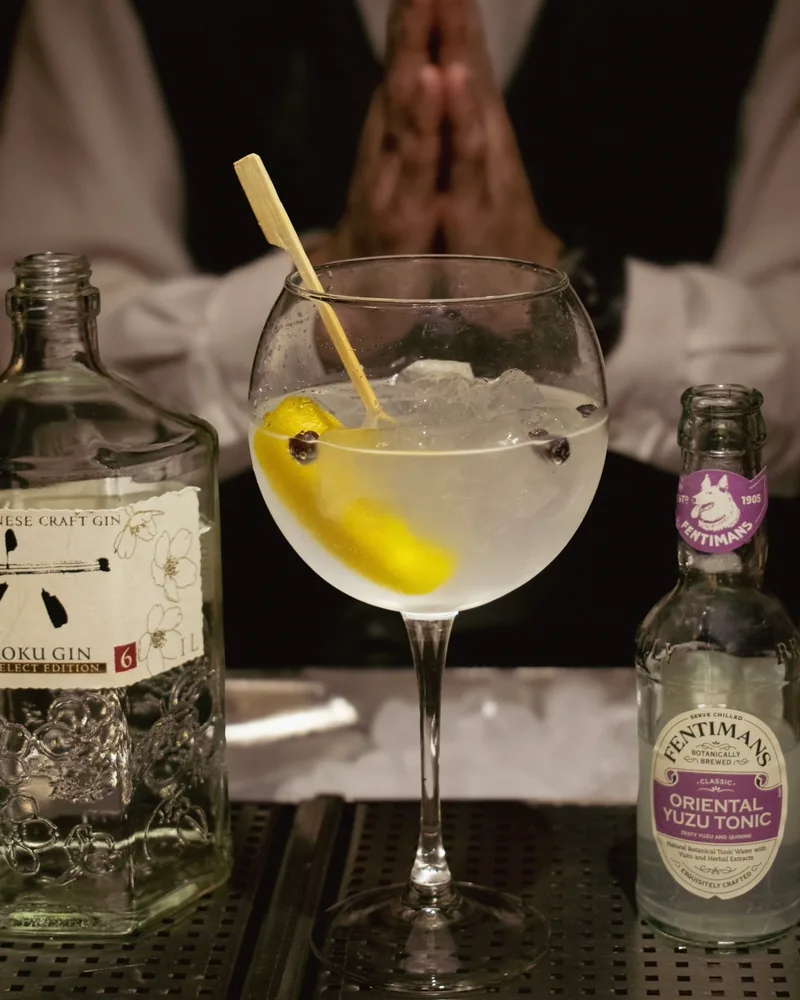 Gin and tonic in a balloon glass with lemon peel at The Gin Corner