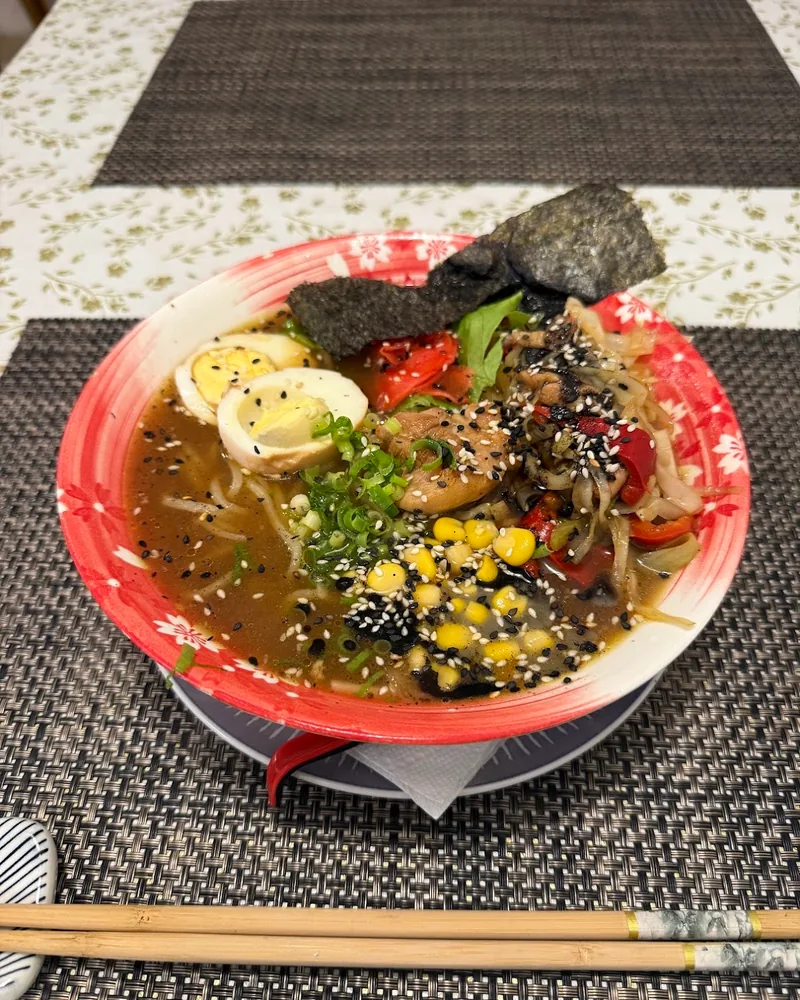 Ramen bowl with a boiled egg, corn and nori at The Yakitori Samurai
