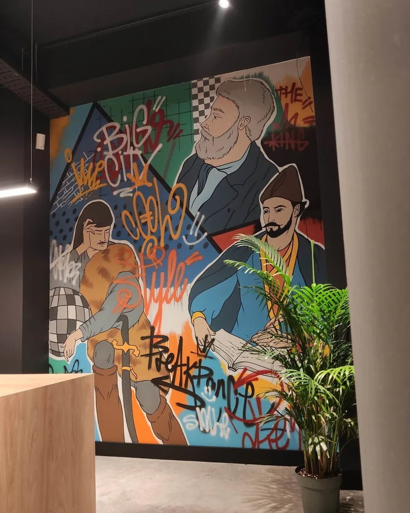 Interior wall mural with modern street art graphics at Tiflis Fast Food