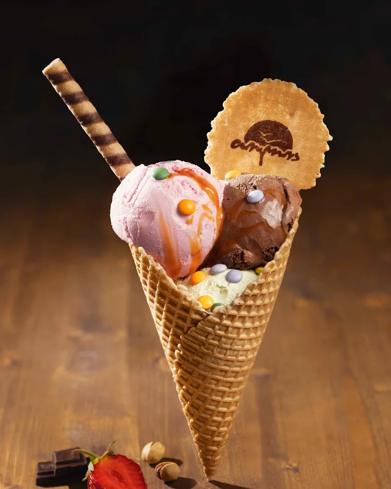 Ice cream waffle cone with wafer and strawberry at Tolia
