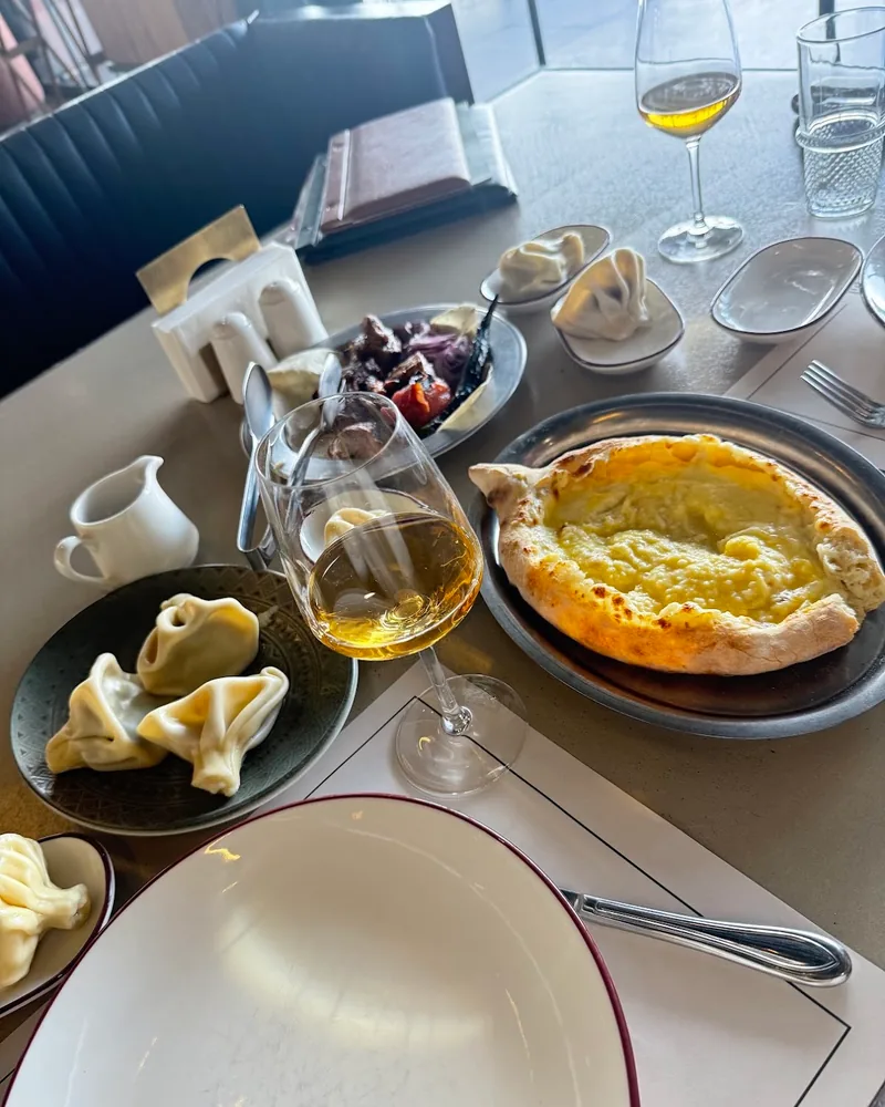 Khachapuri and khinkali spread with white wine at Tsiskvili Terrace