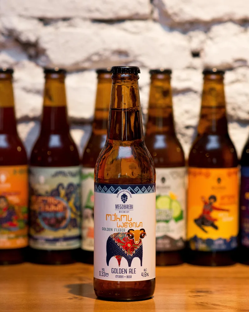 Bottled craft beers with a Megobrebi golden ale in front at Tsota Tsota