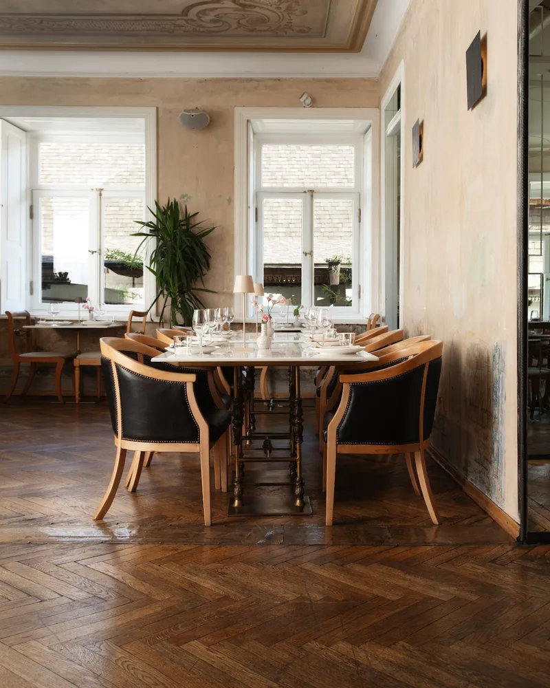 Dining room with painted ceiling and herringbone parquet floor at Unfound Door
