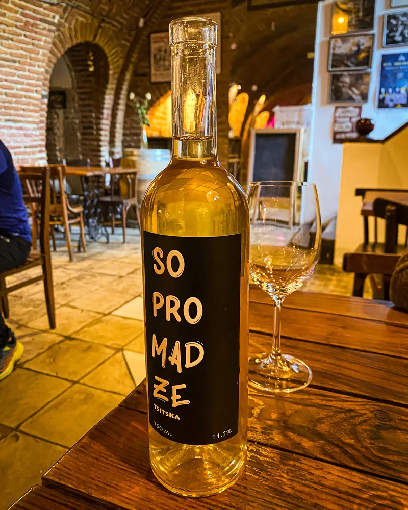 Sopromadze tsitska white wine bottle with glass at Vino Underground