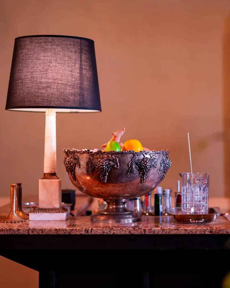Marble bar counter with vintage lamp and champagne bowl at Weller