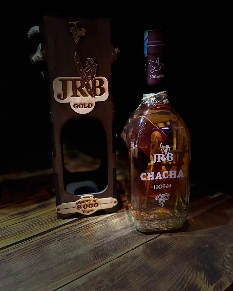 Bottle of Chacha Gold with a decorative wooden box at Wine Tower