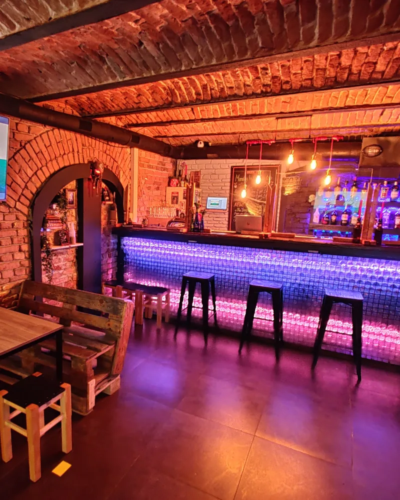 Brick-vaulted bar cellar with illuminated counter at World's End Bar