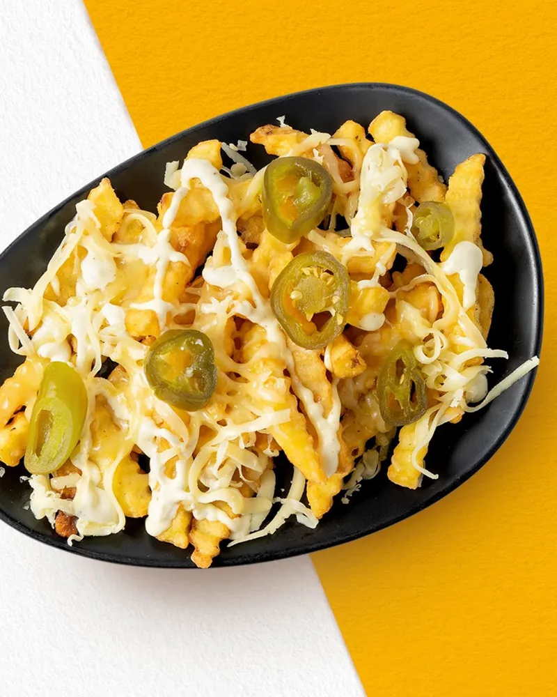 Loaded crinkle-cut fries with melted cheese and jalapenos at Wrap Master